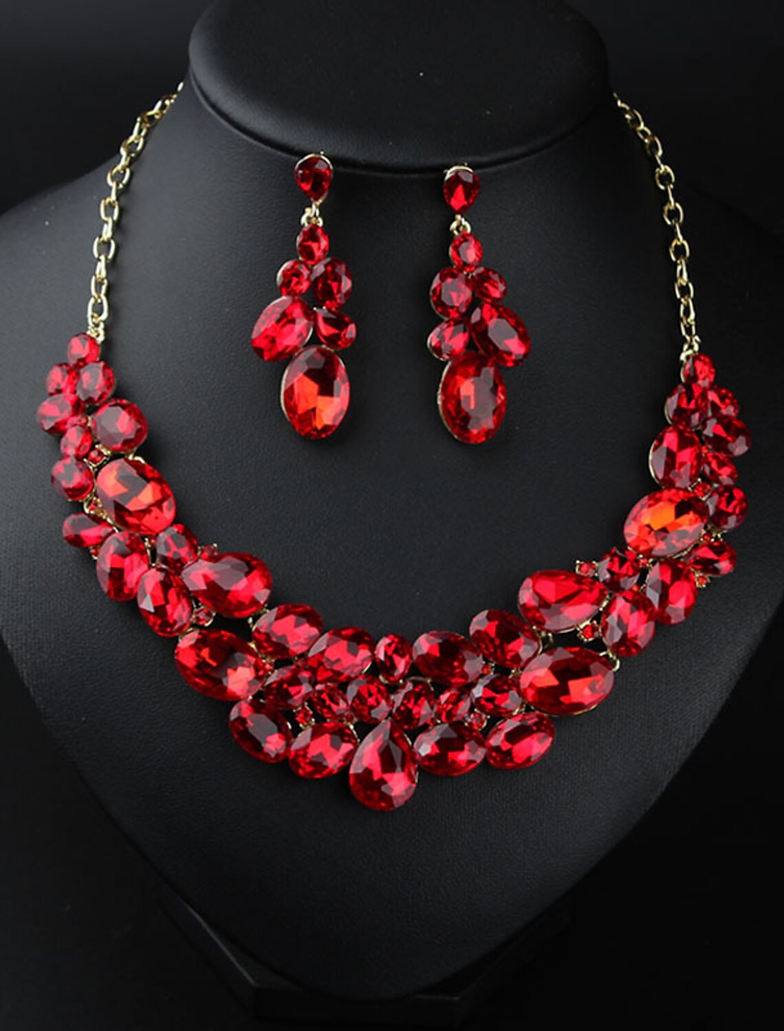 Elegant crystal rhinestone bridal necklace and matching earrings set with floral design.