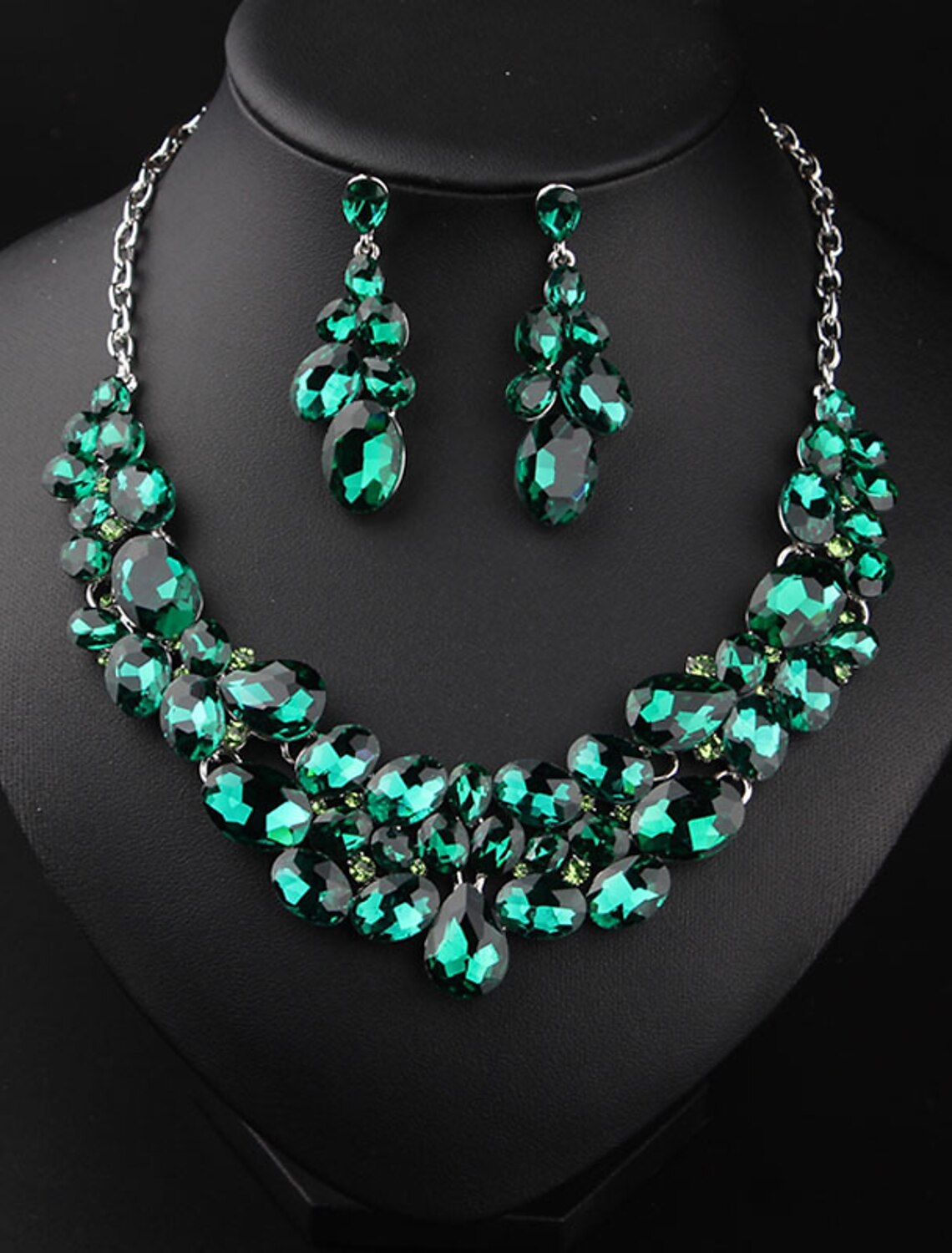 Close-up of crystal rhinestone bridal jewelry set, showing intricate details.