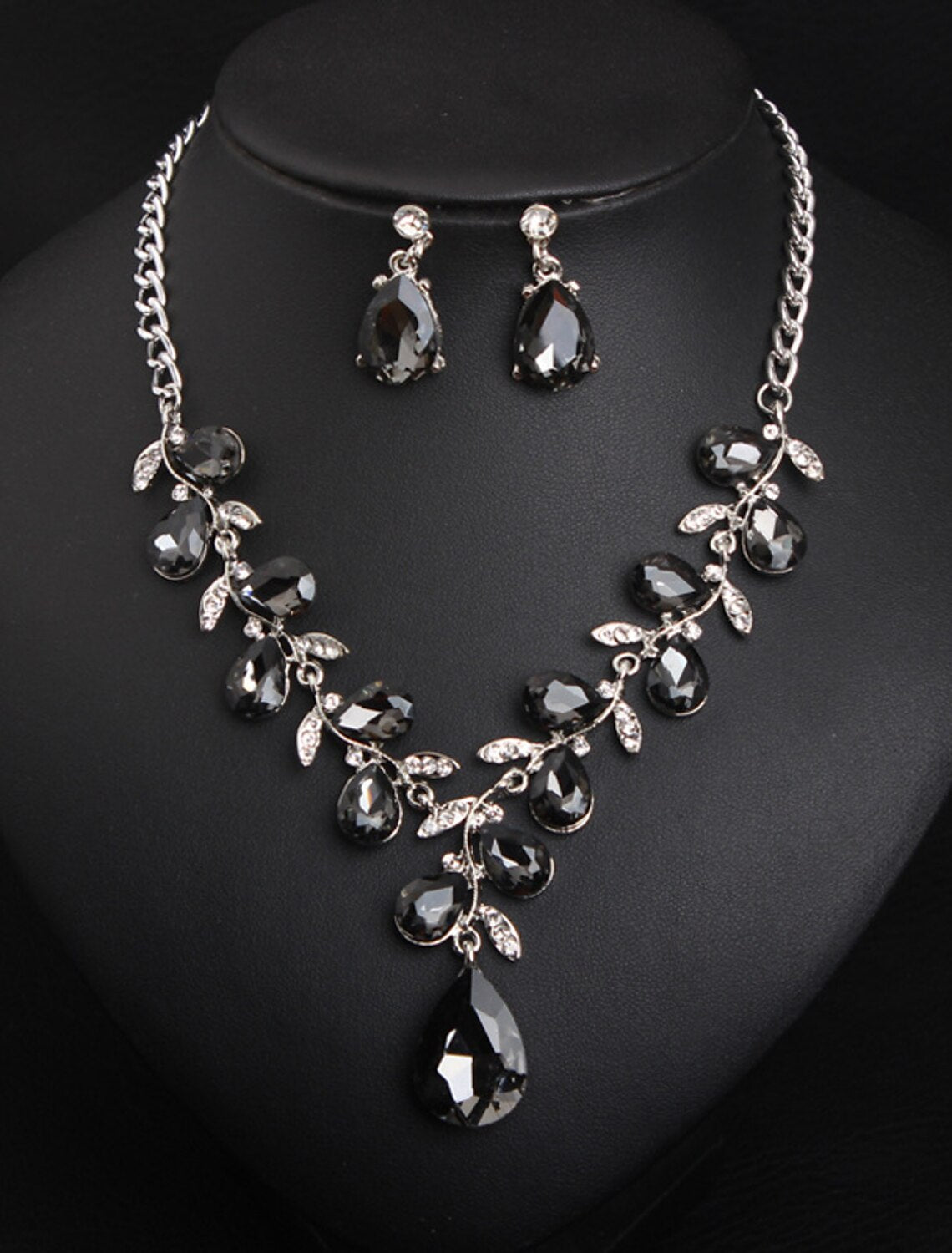 Sparkling crystal rhinestone earrings with a floral pattern.