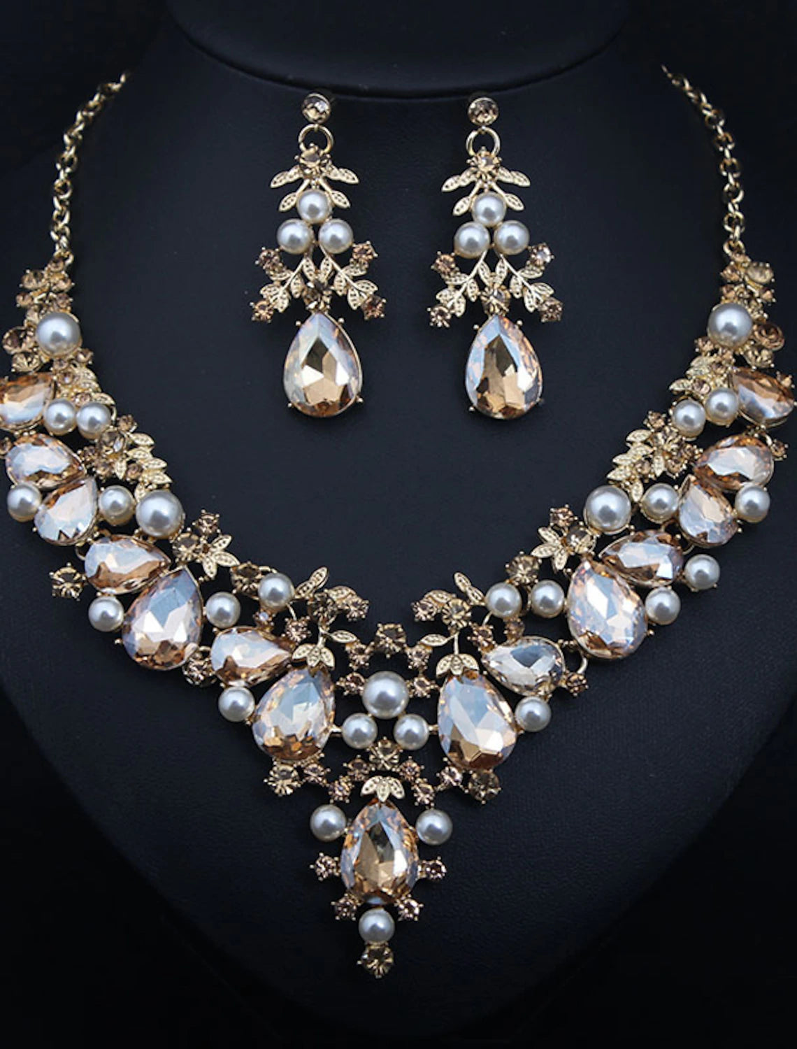 Model wearing a crystal rhinestone flower bridal necklace and matching earrings.