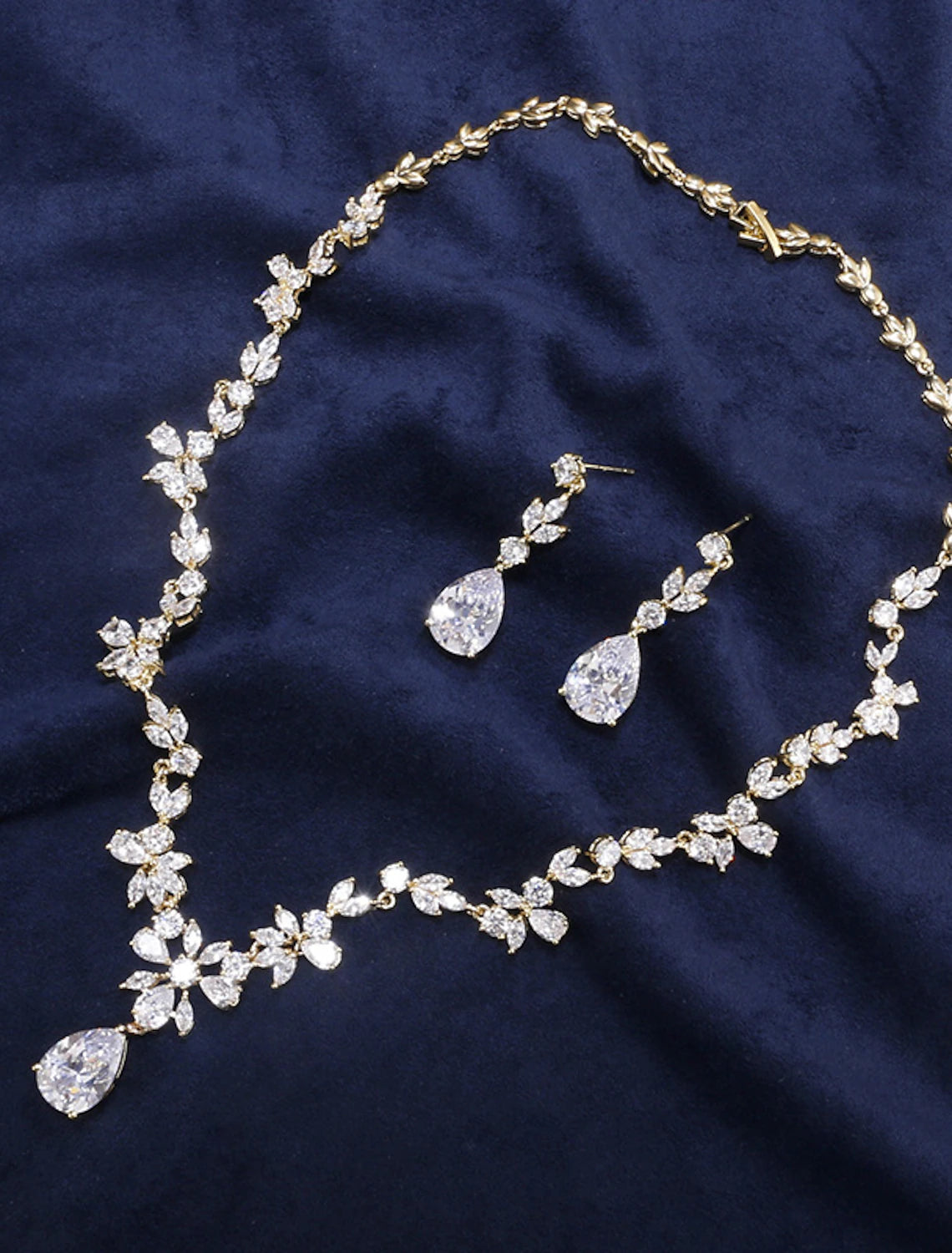Bridal jewelry set with necklace and earrings on display.