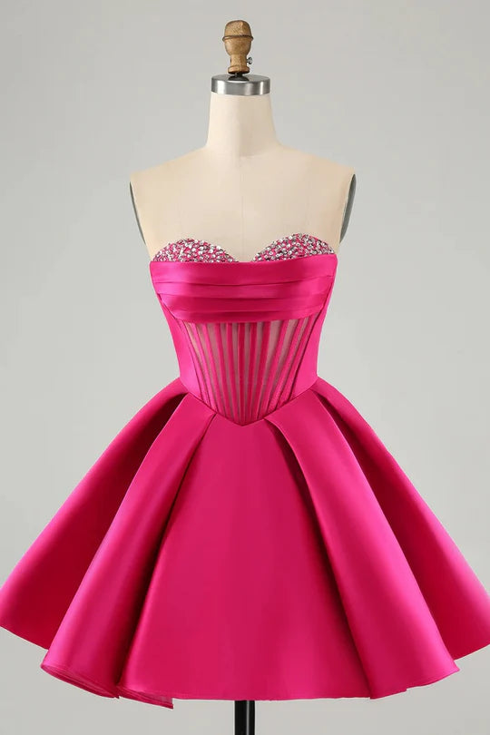 Front view of a model wearing a short A-line sweetheart corset homecoming dress with beading.