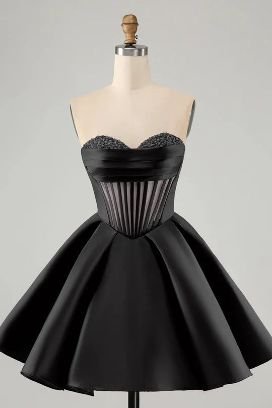 Full length view of a model posing in a short A-line sweetheart corset homecoming dress.