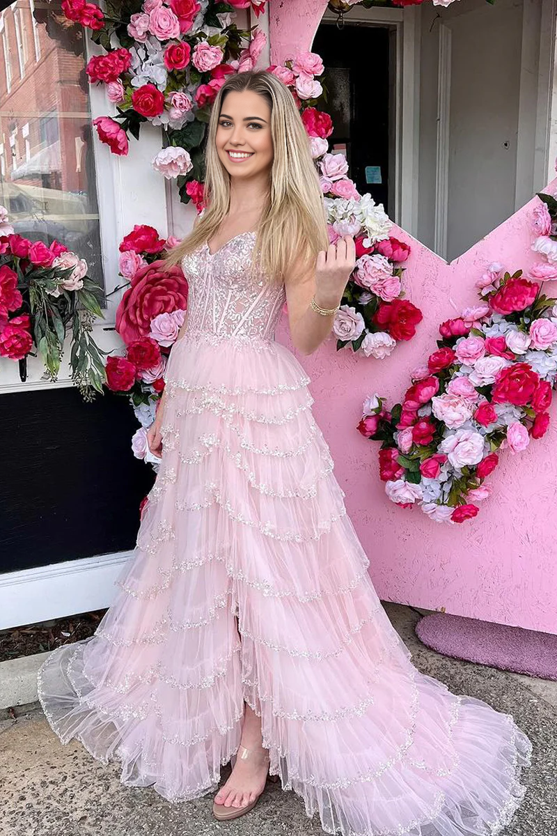 Back view of the light pink A-line prom dress, showcasing the flowing tulle skirt.