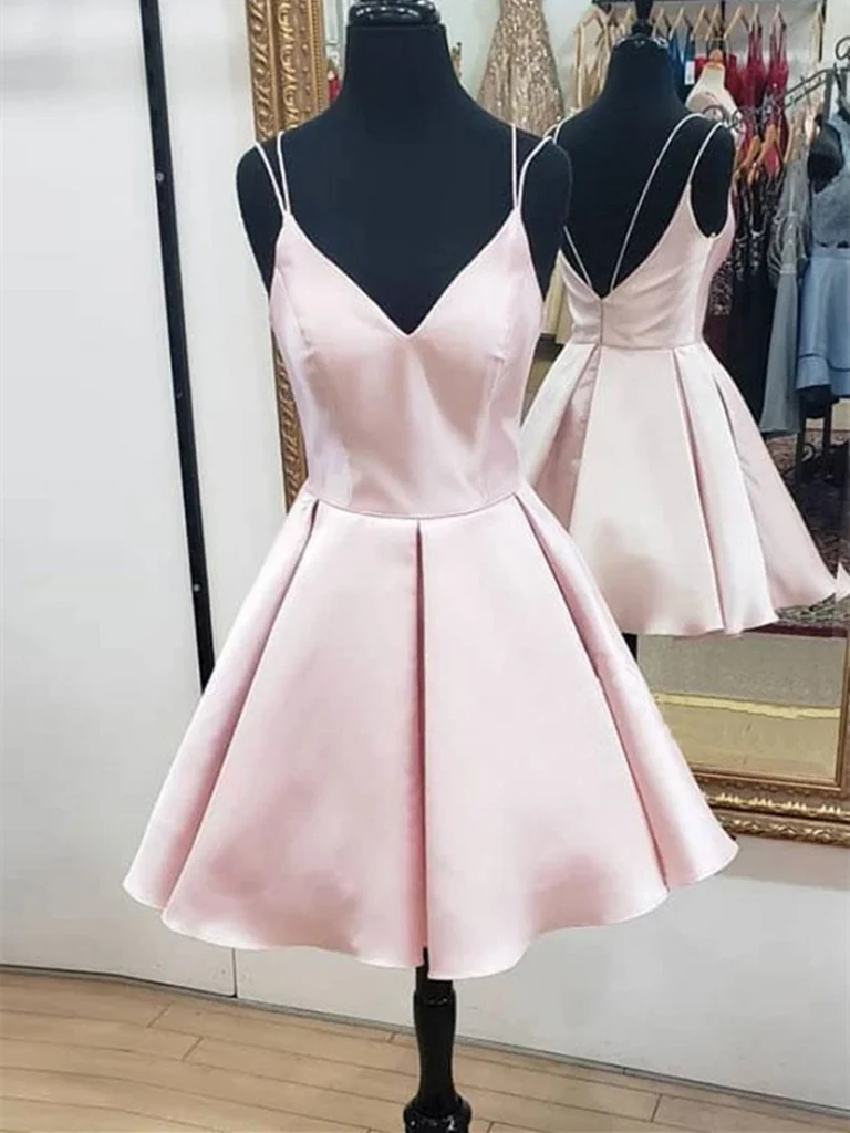Model wearing a short A-line V-neck open back prom dress.