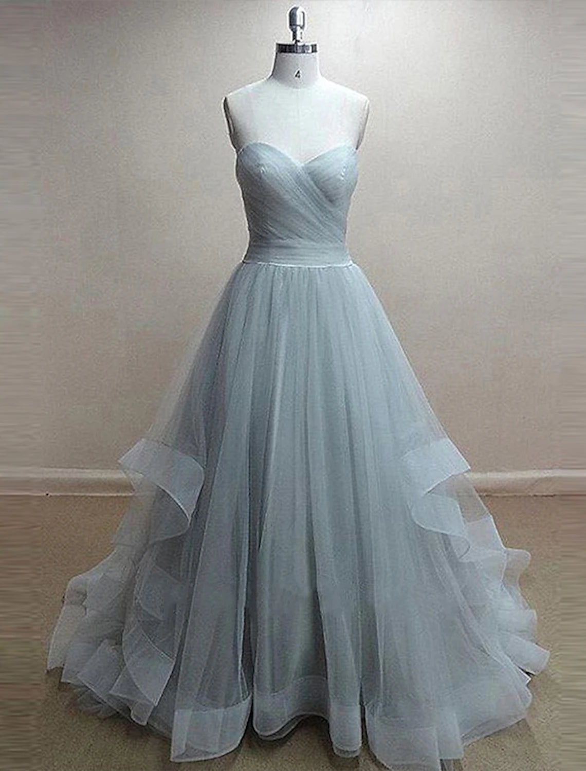 A-Line sweetheart prom dress with pleats and ruffles.
