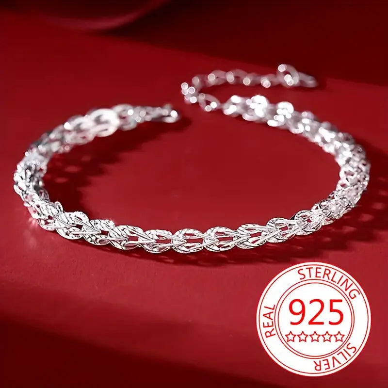 Dainty 925 sterling silver phoenix tail bracelet on a white background.