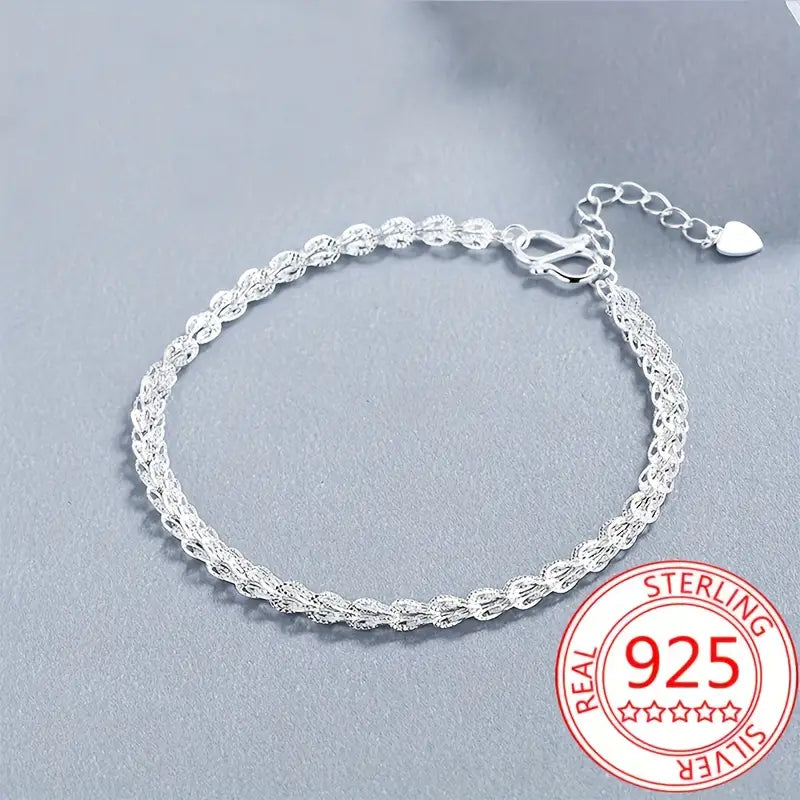 Adjustable 925 sterling silver bracelet with phoenix tail detail.