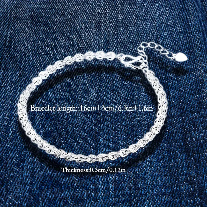 Model wearing the elegant 925 silver phoenix tail bracelet on her wrist.