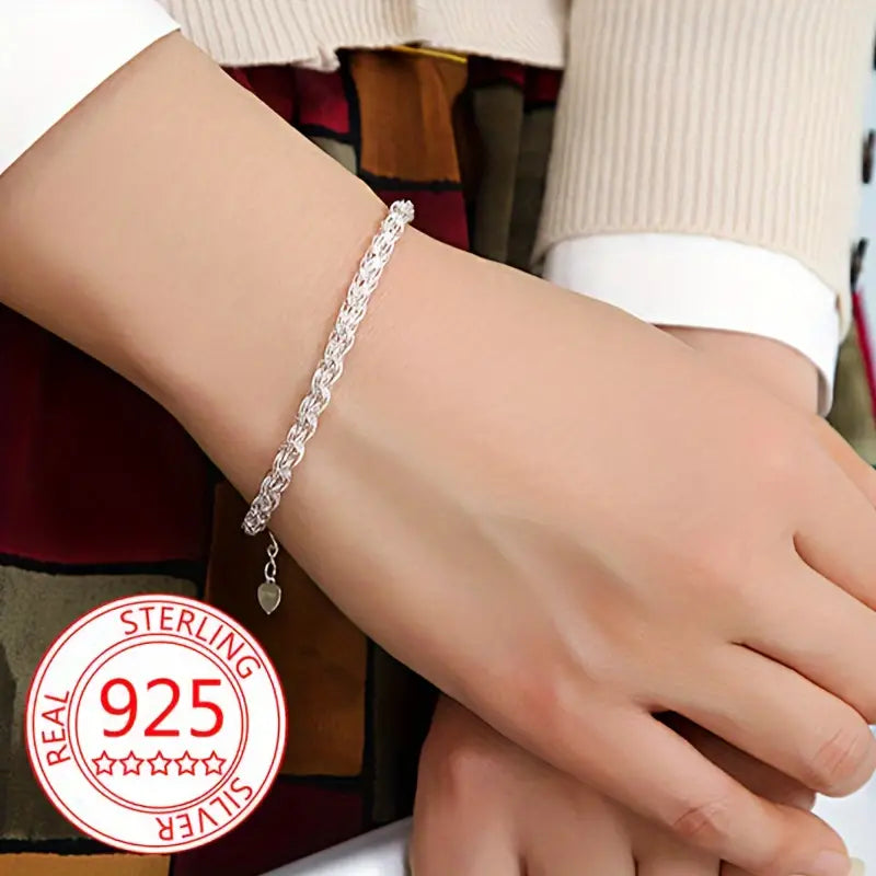 Top-down view of the dainty 925 silver bracelet.