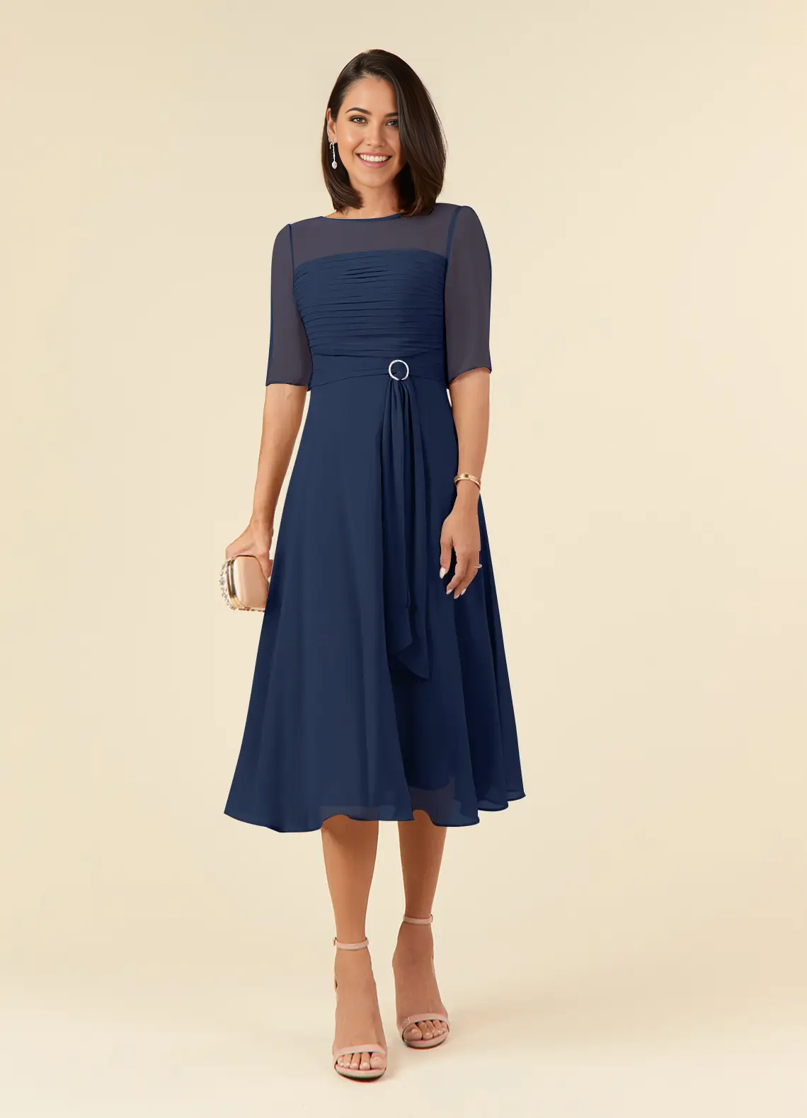 Woman wearing a dark navy A-line boatneck pleated chiffon dress.