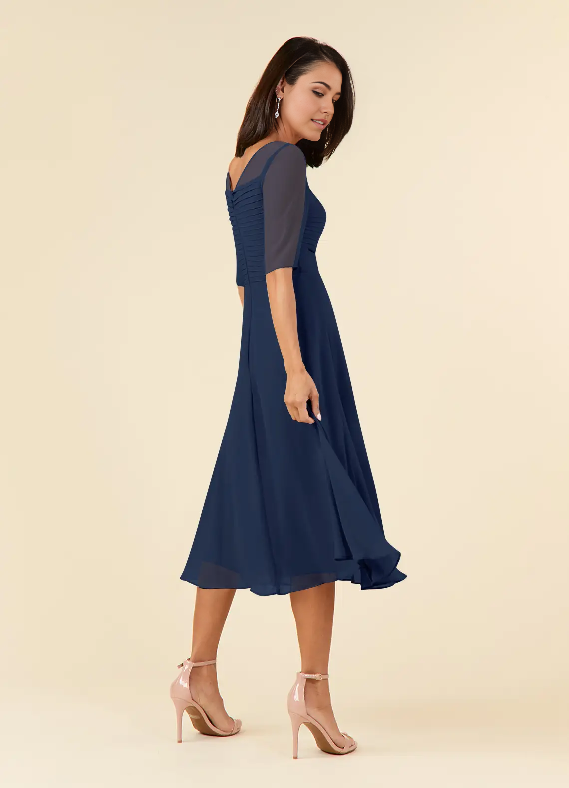 Full length view of an elegant dark navy A-line dress.