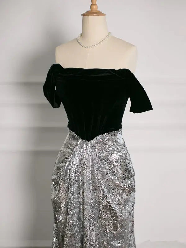 Close-up of sequin detail on off-shoulder evening gown.