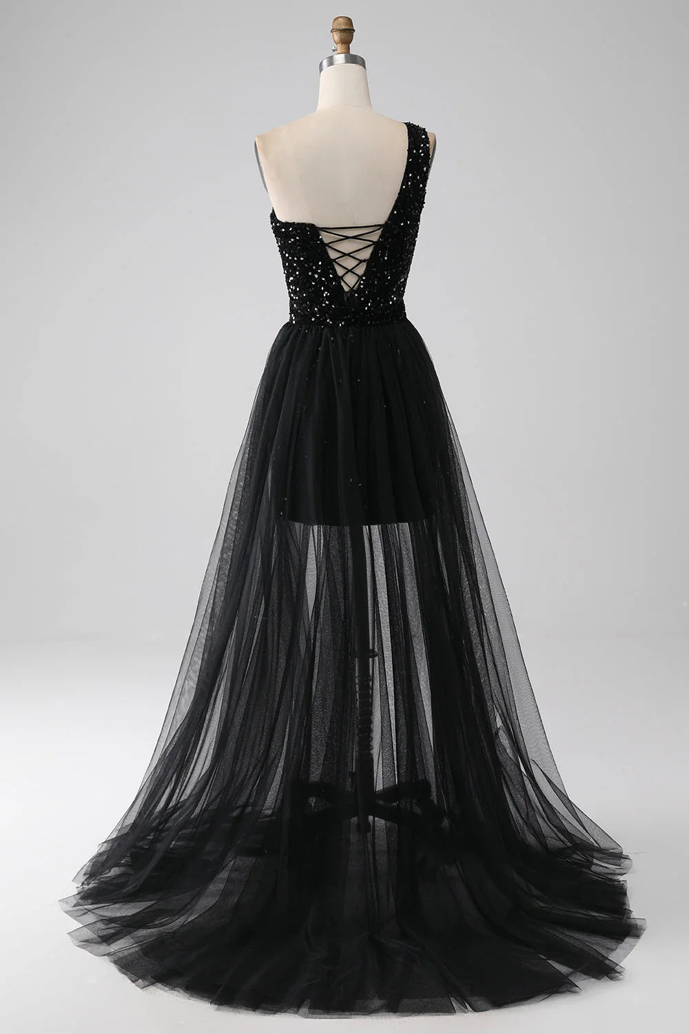 Black A-line one-shoulder sequin prom dress, side view.