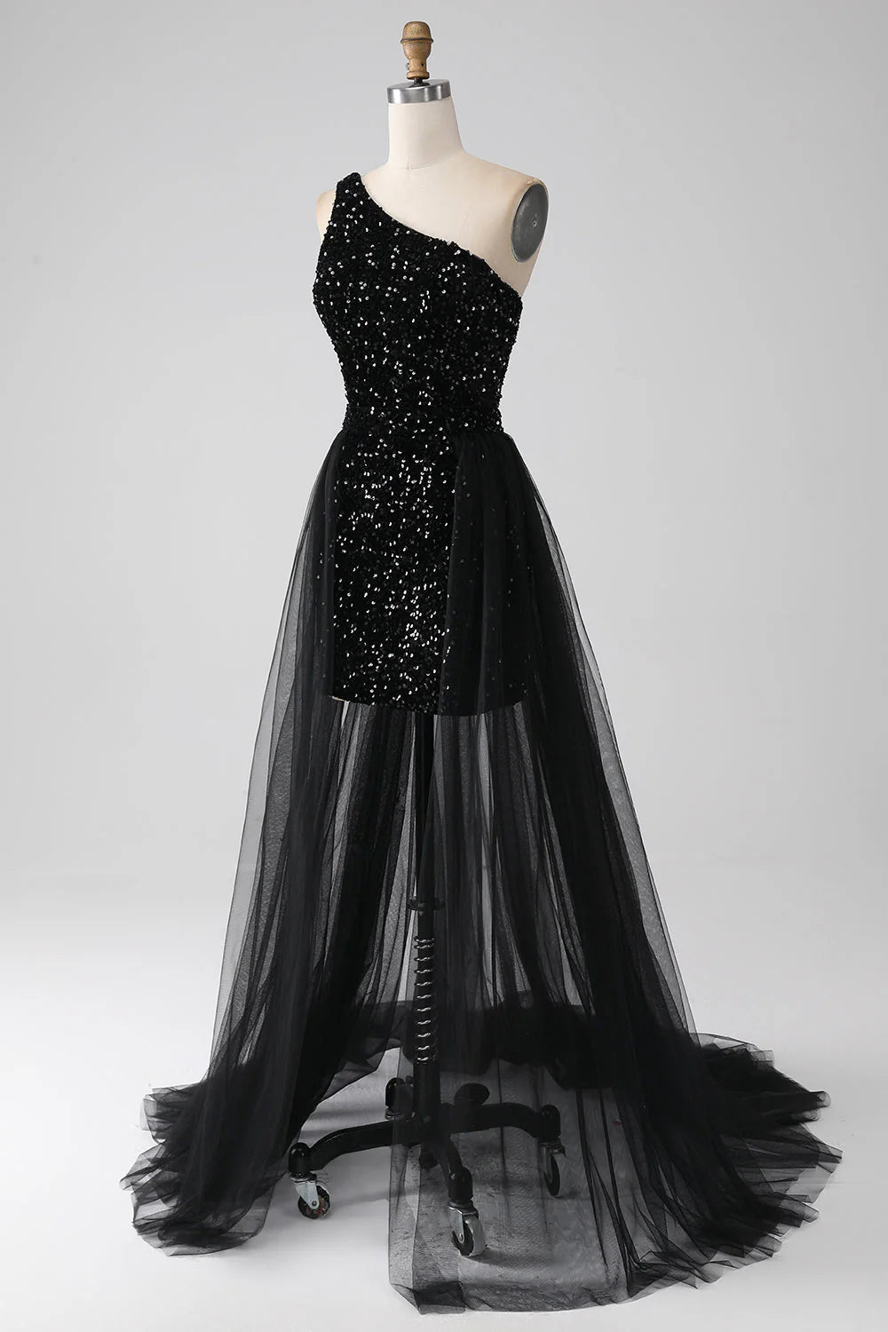 Close-up of sequin detail on a black one-shoulder prom dress.