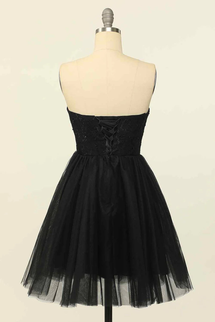 Back view of the A-line strapless mini dress, highlighting the lace-up closure.