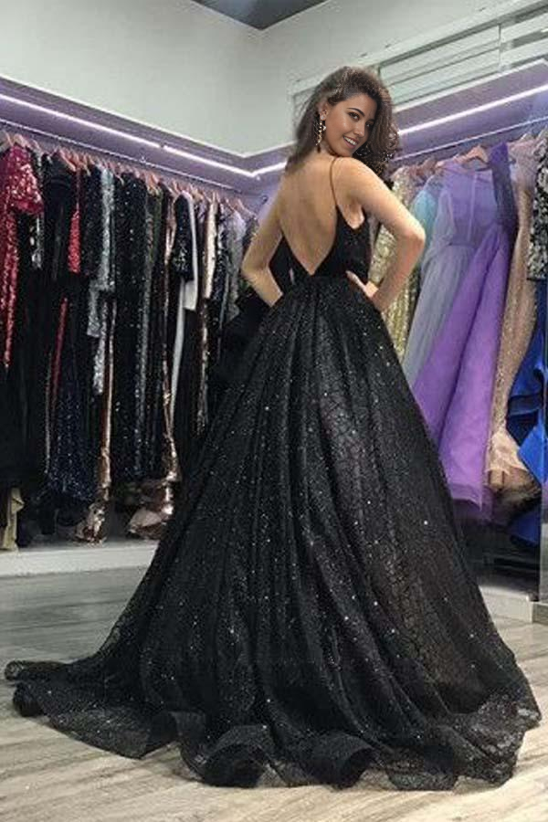 Close-up of the shimmering black sequin fabric and V-neckline of the elegant prom gown.