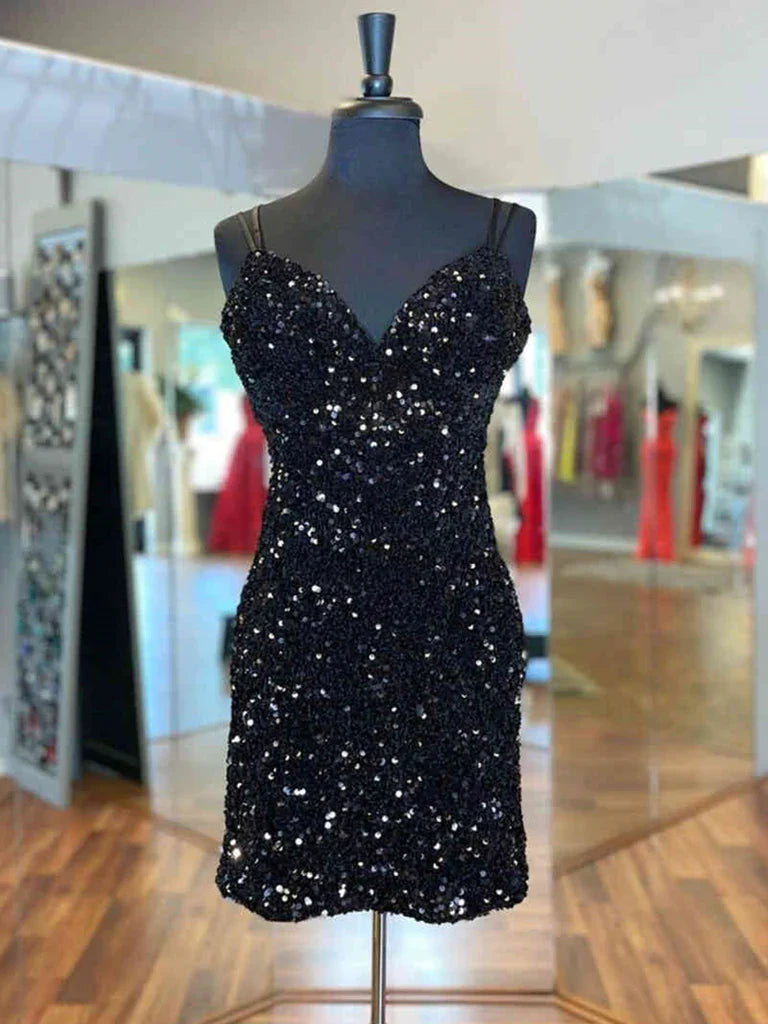 Woman in a dazzling short gold sequin backless V-neck A-line prom dress.