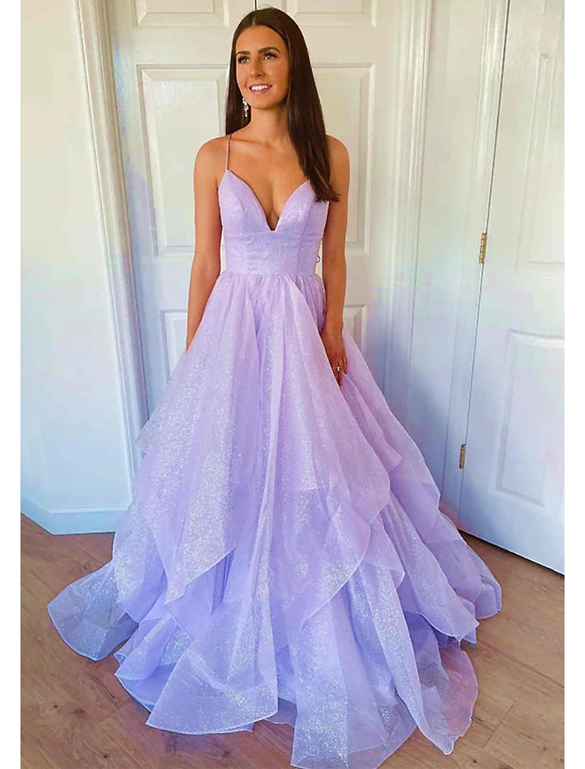 Dazzling silver ball gown prom dress with spaghetti straps and court train.