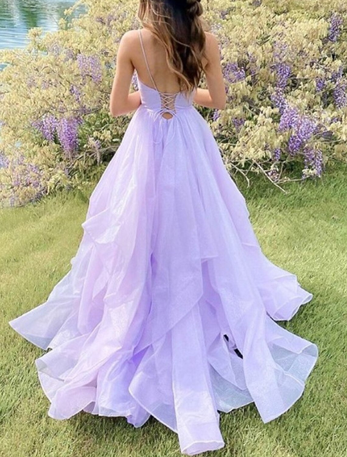 Back view of a glittering sequin ball gown with elegant spaghetti straps.