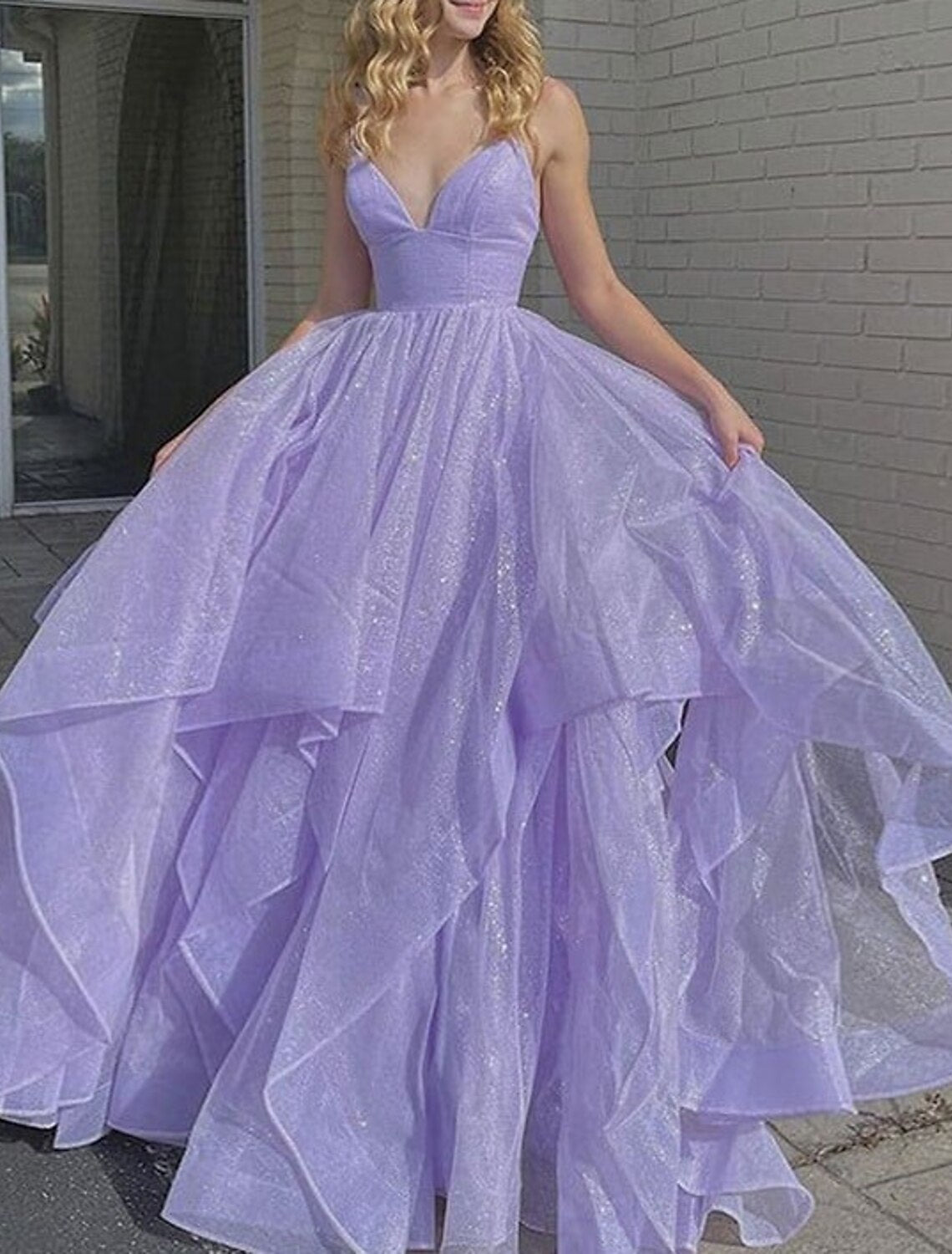 Close-up of the sequin ruffles and glittering fabric on a formal ball gown.