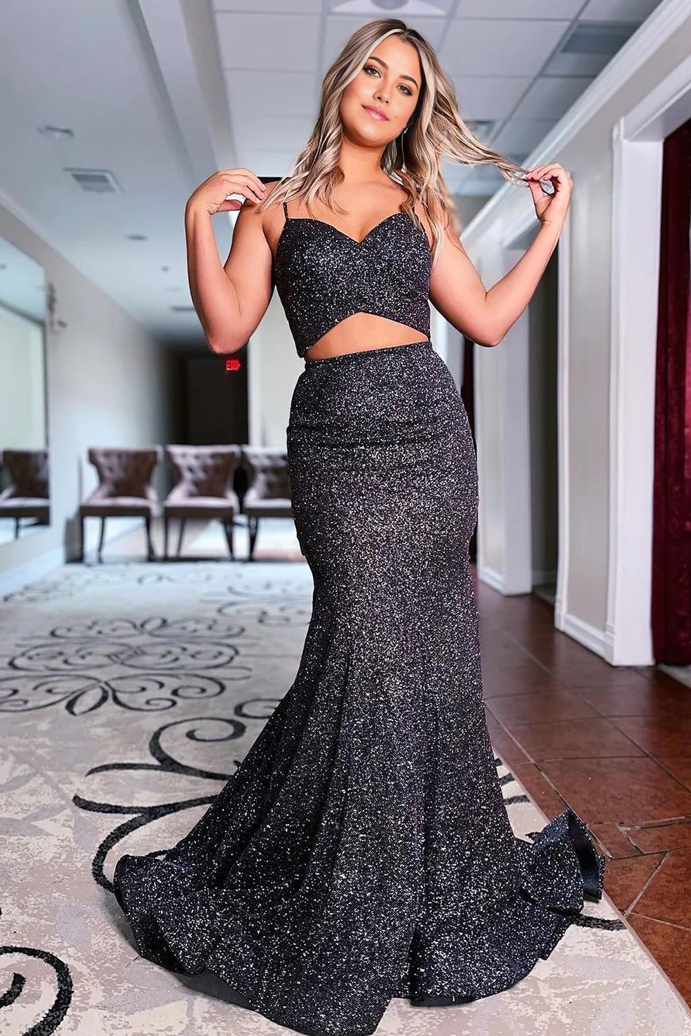 Elegant black sequin mermaid formal dress with spaghetti straps.