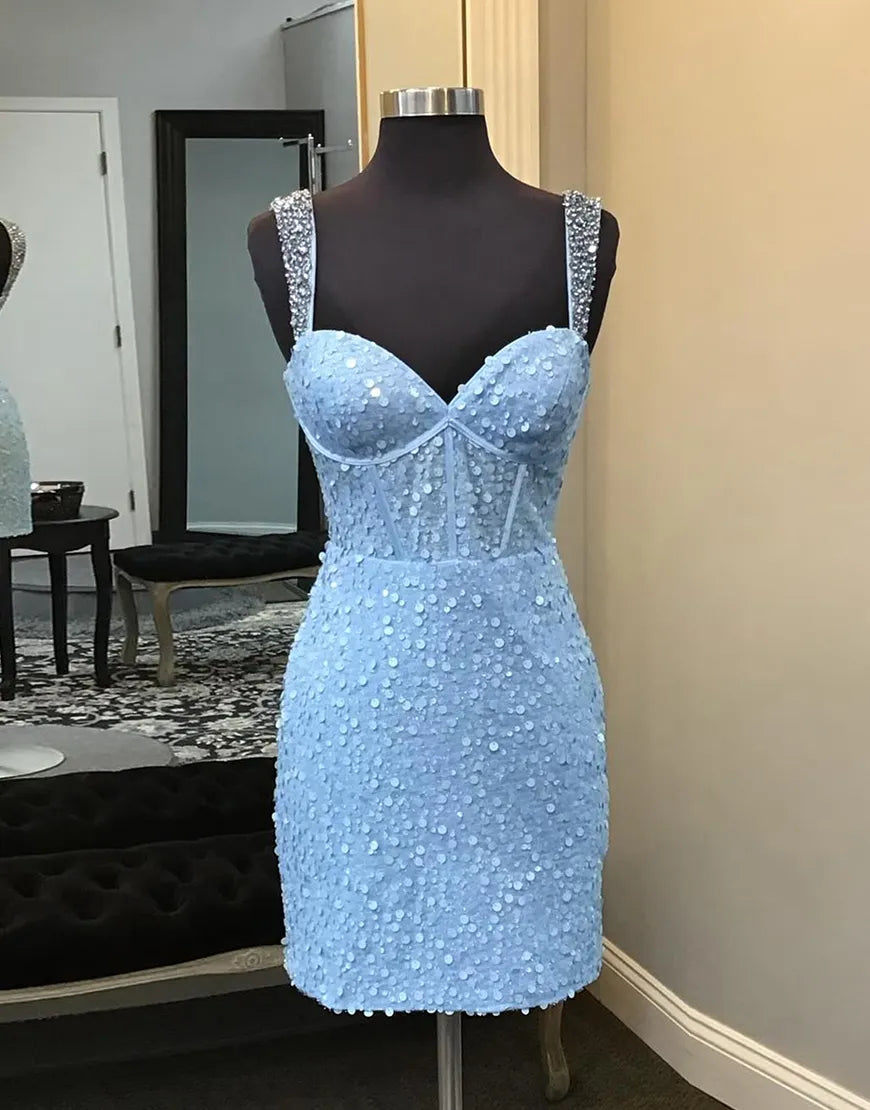 Blue sequin and glitter maxi dress with a halter neckline and corset bodice.