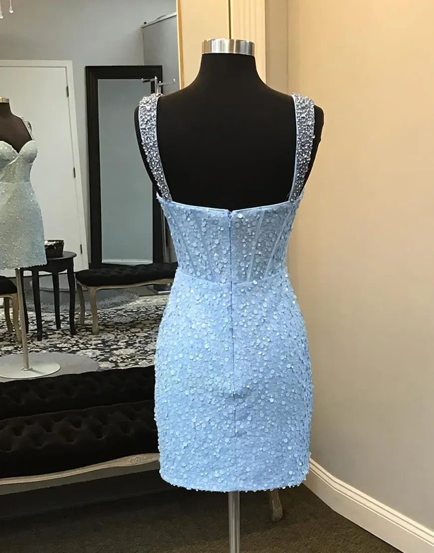 Back view of the blue sequin halter maxi gown, showing the flowing skirt.