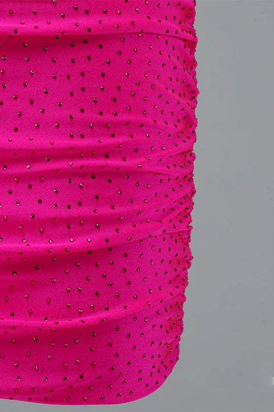 Close-up of the shimmering fabric on a sparkly bodycon mini dress.