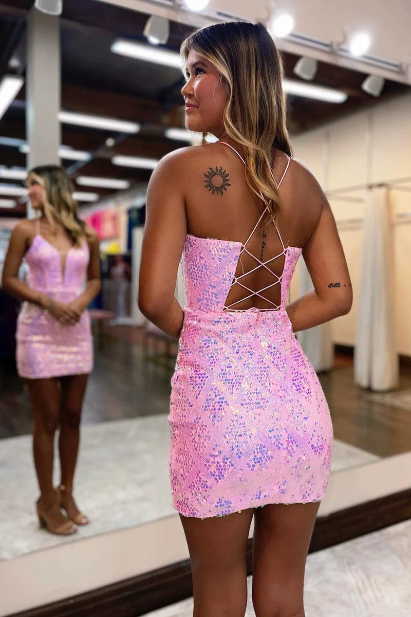 Model posing in a shimmering sequined V-neck bodycon dress, side view.