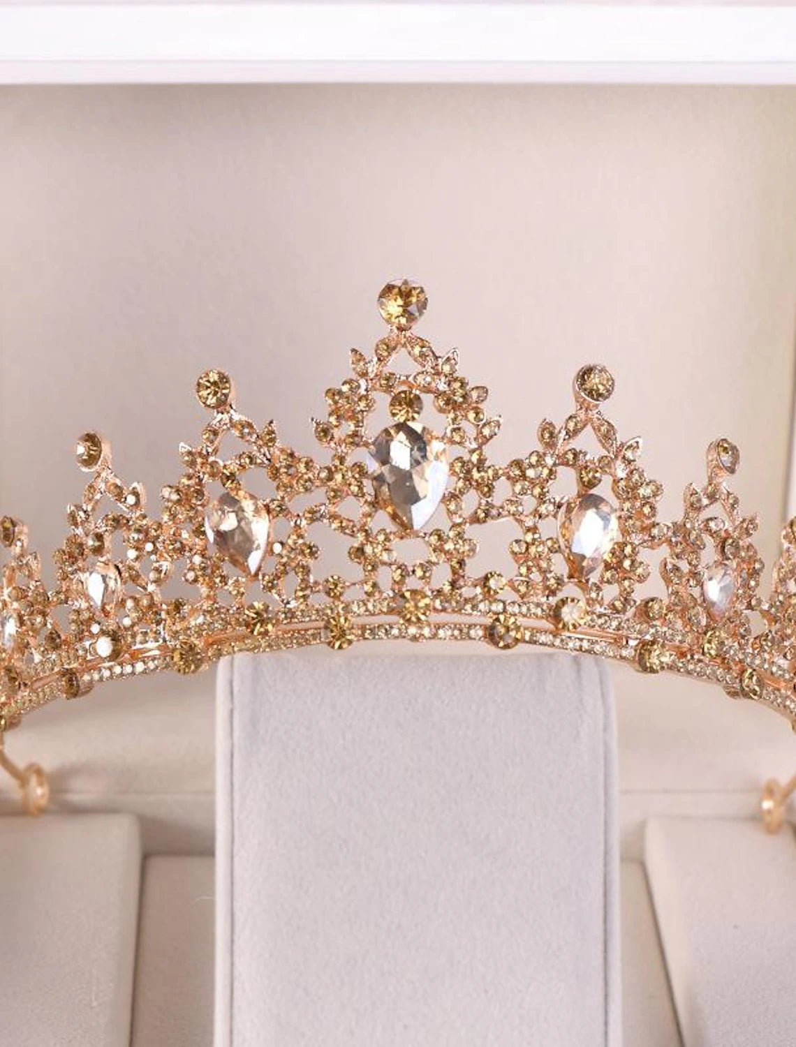 Crystal tiara displayed, highlighting its versatile use for various occasions.