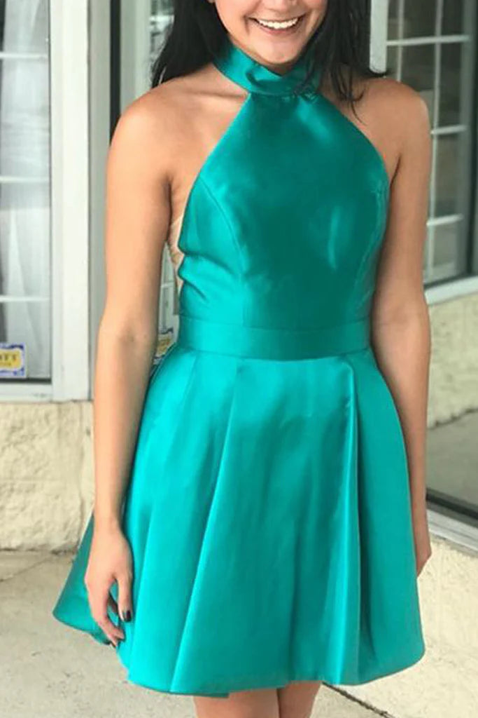 A woman wearing a dazzling halter high neck satin short prom homecoming dress.