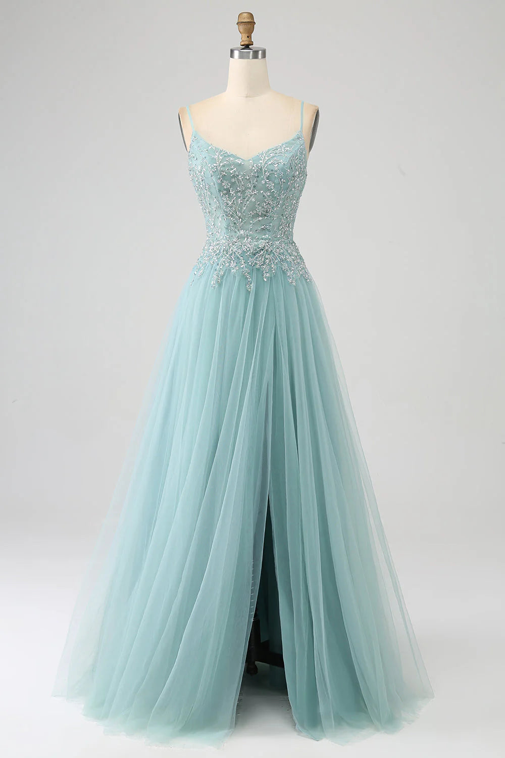 Light green A-line sequin prom dress with corset bodice and high slit.