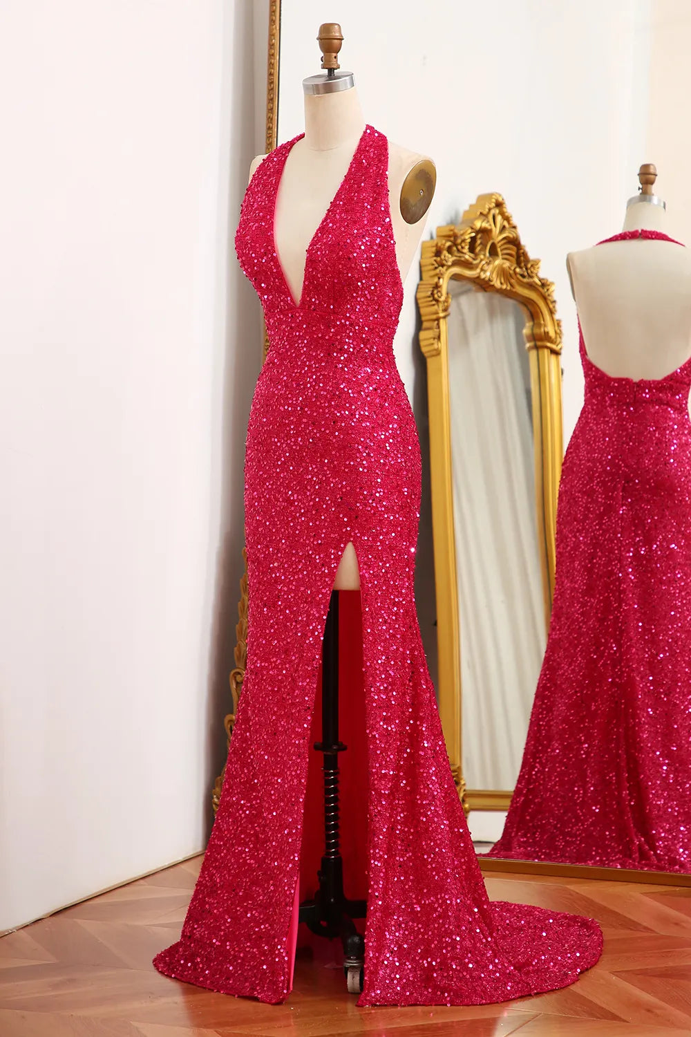 Halter neck sequin gown with a high split.