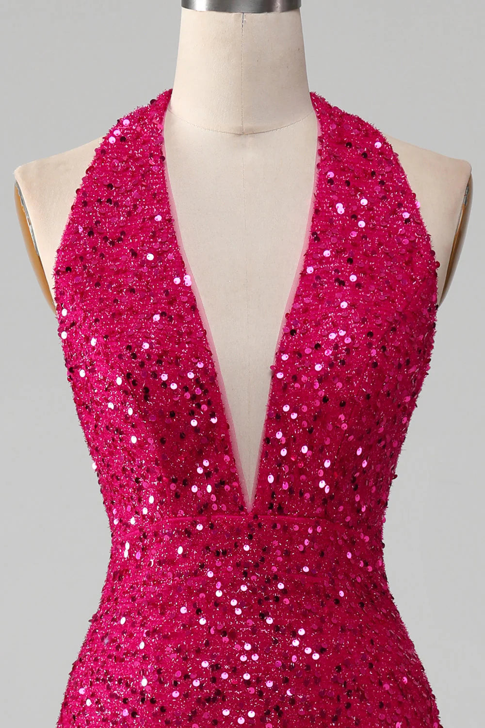 Side view of the fuchsia mermaid halter sequin prom dress.