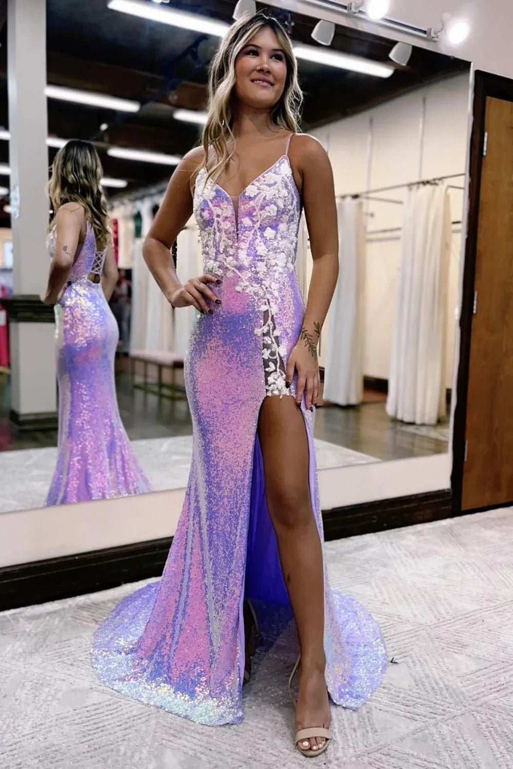 Elegant mermaid sequin prom dress with spaghetti straps and a front split.