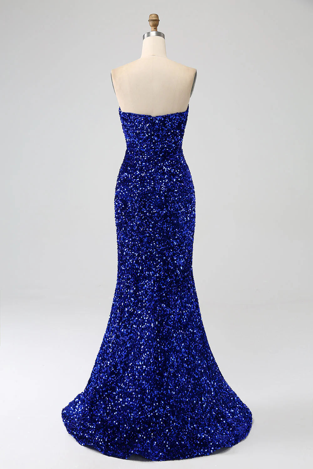 Back view of a royal blue mermaid strapless sequin long prom dress.