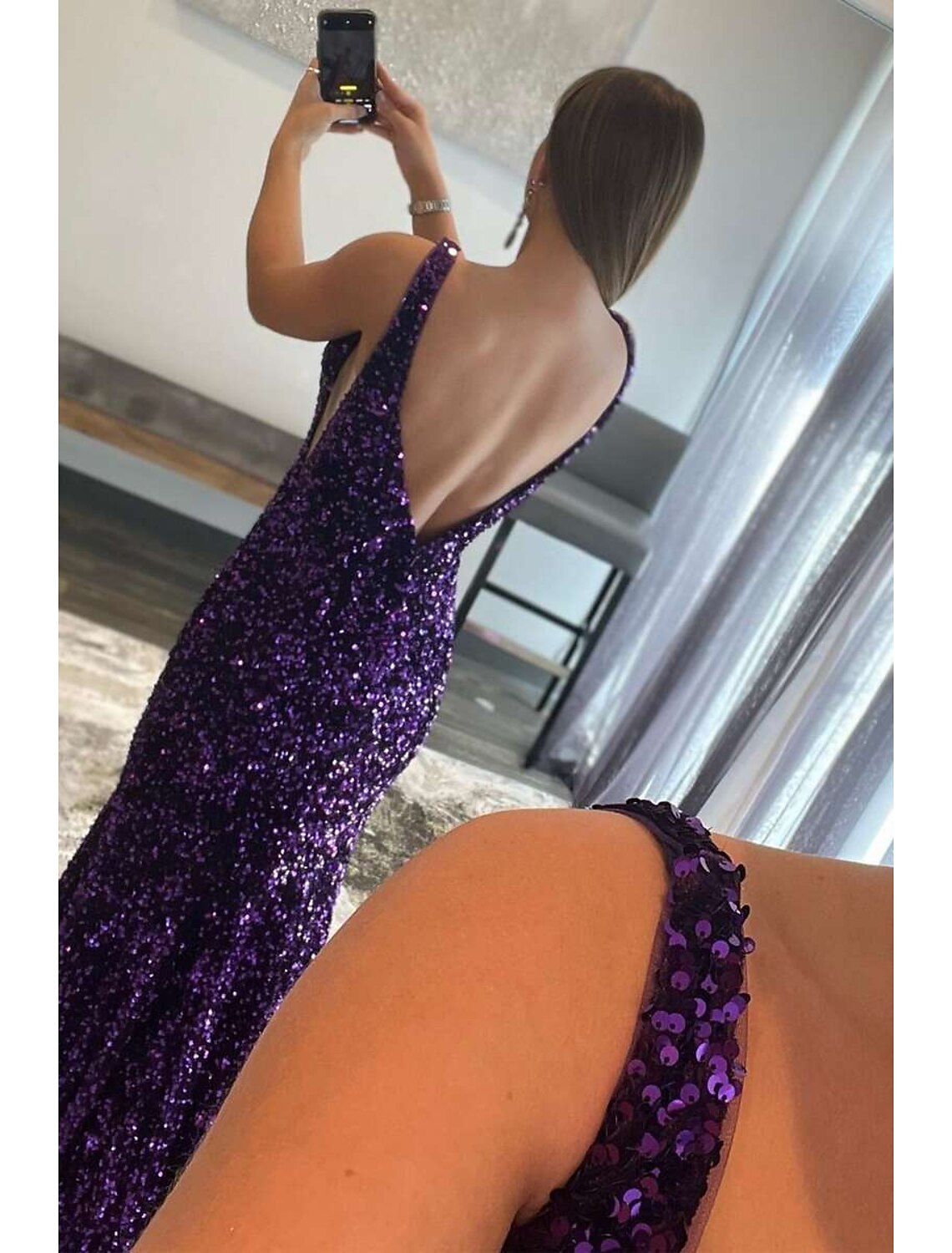 Close-up of the shimmering sequin detail on the V-neck prom dress.