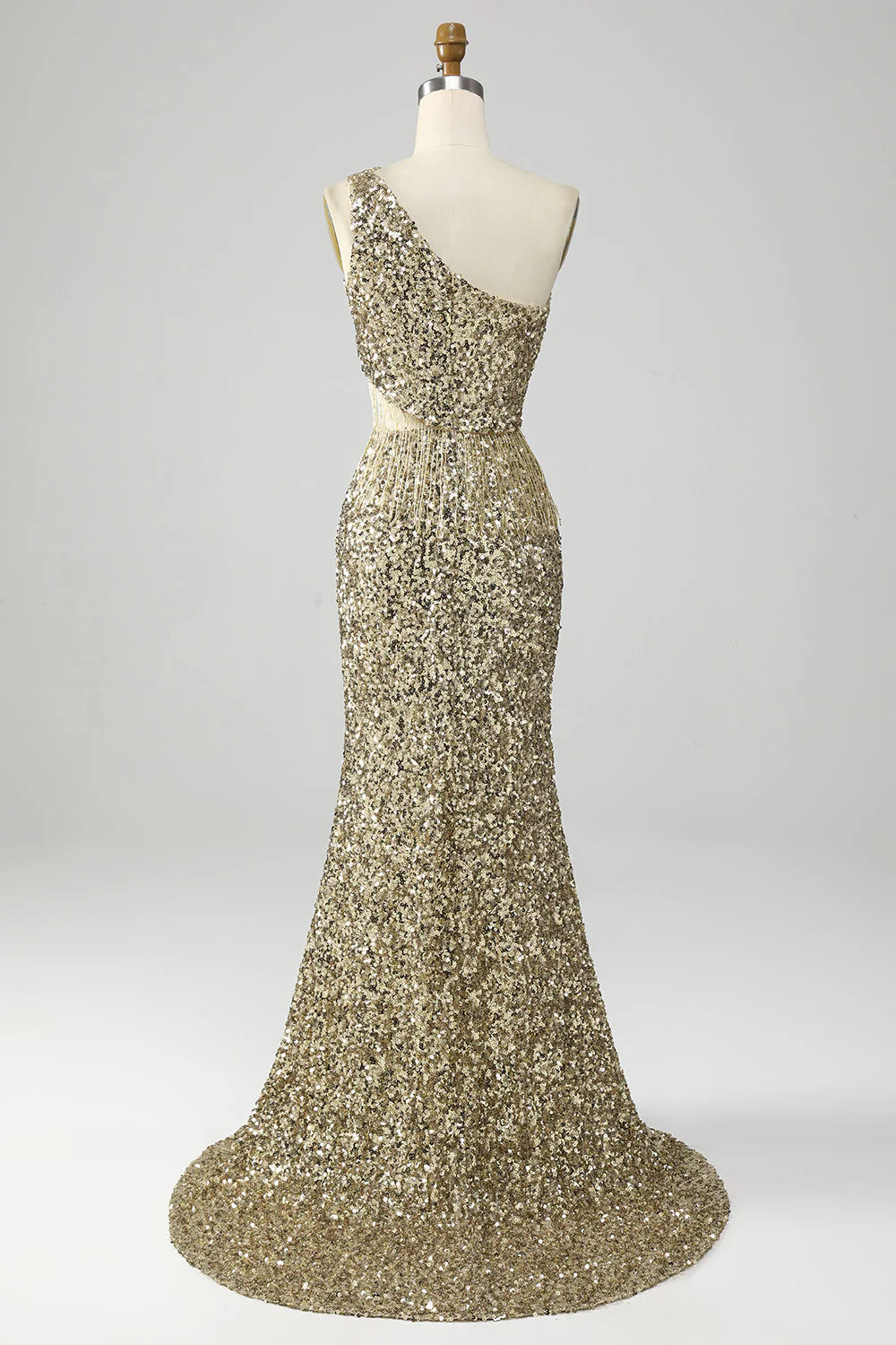 Close-up of the sequin and fringe details on the golden one-shoulder prom dress.