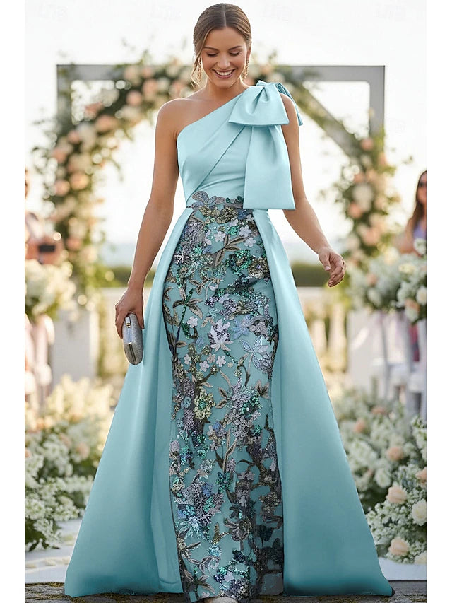 Model wearing a shimmering rose gold sequin gown with a plunge V-neck.