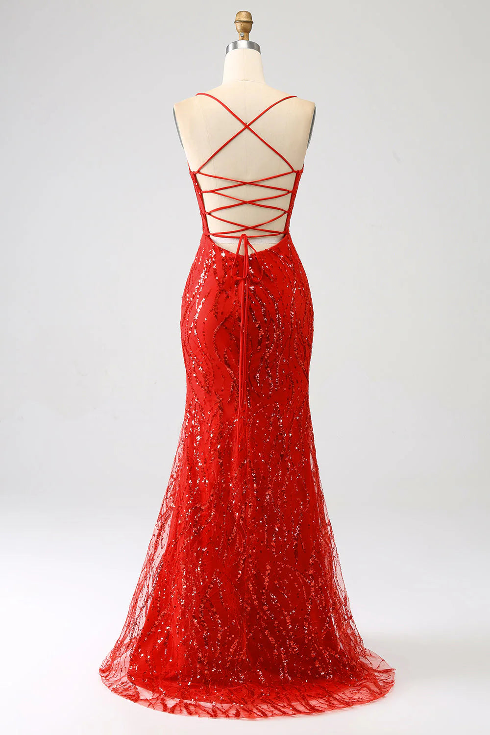 Back view of a woman wearing a red sequined mermaid formal dress.