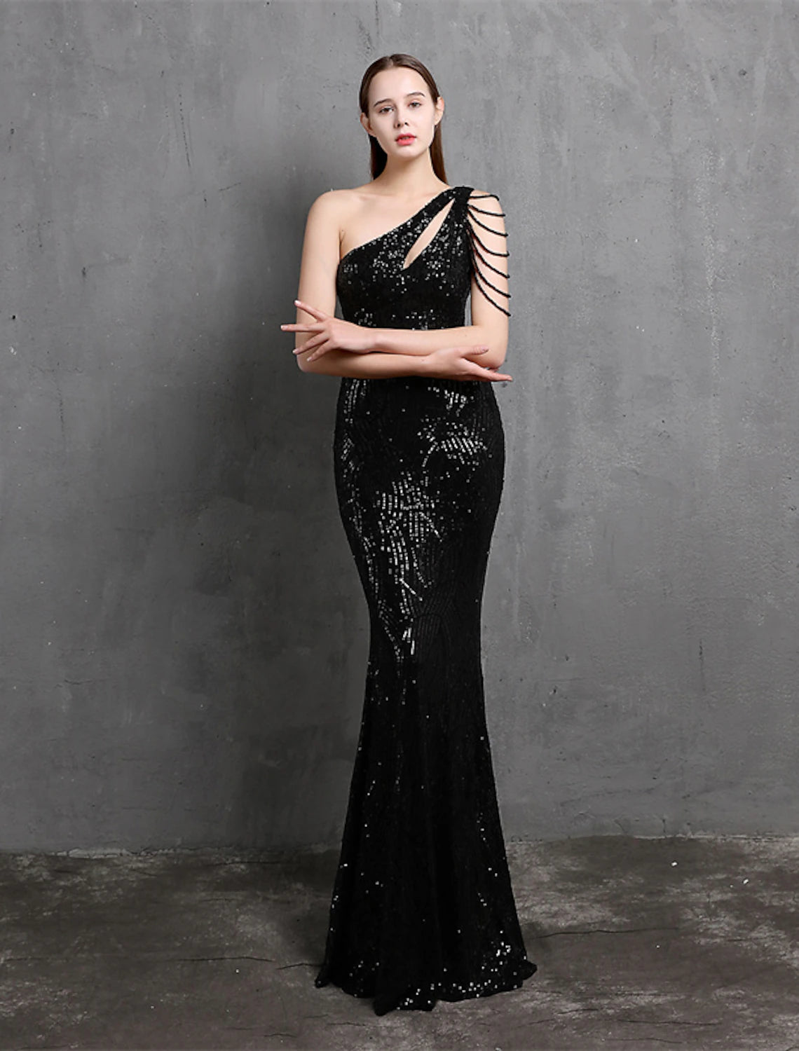 Back view of a floor-length sequined formal dress.