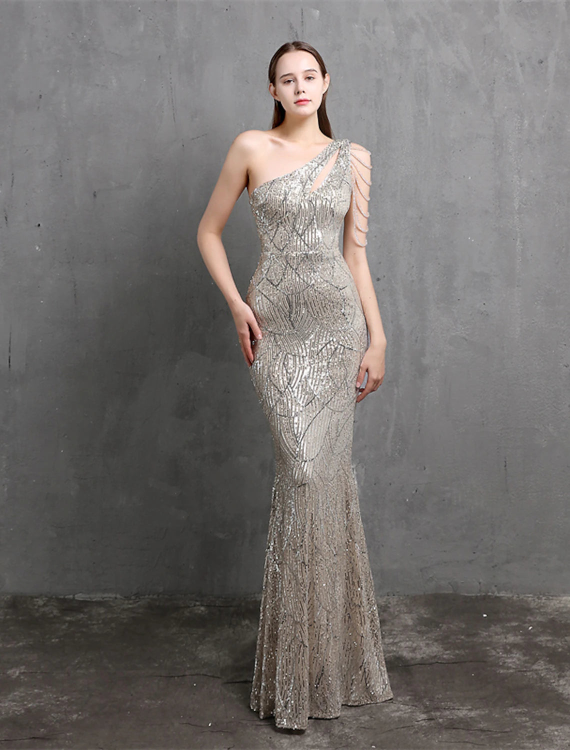Side profile of a sparkling one-shoulder evening gown.
