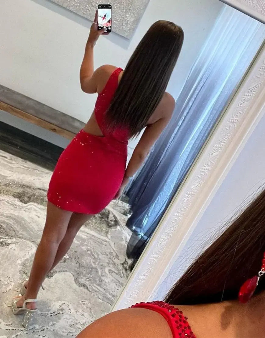 Back view of red glitter one-shoulder dress.