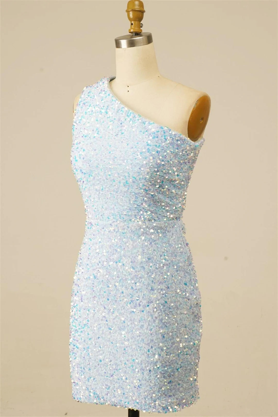 Back view of a sequin one-shoulder homecoming dress with lace-up detail.