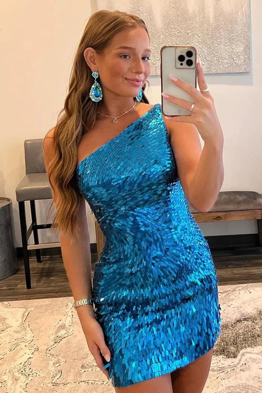 Close-up of the shimmering sequins on the one-shoulder homecoming dress.