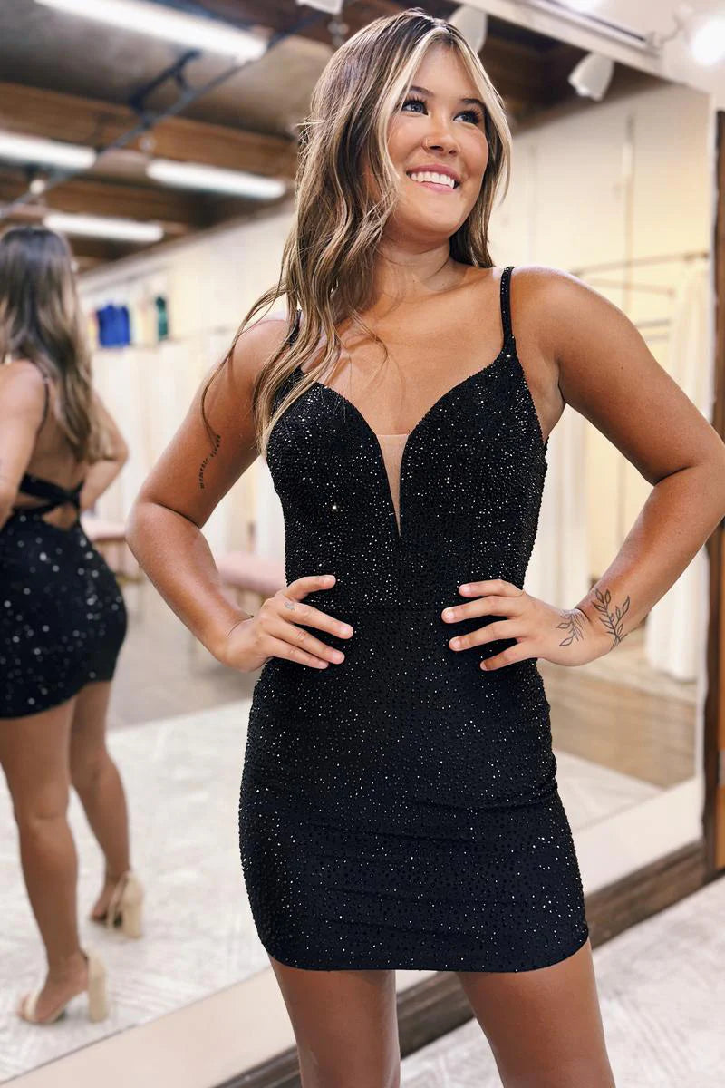 Model wearing a dazzling sparkly bodycon V-neck mini homecoming dress.