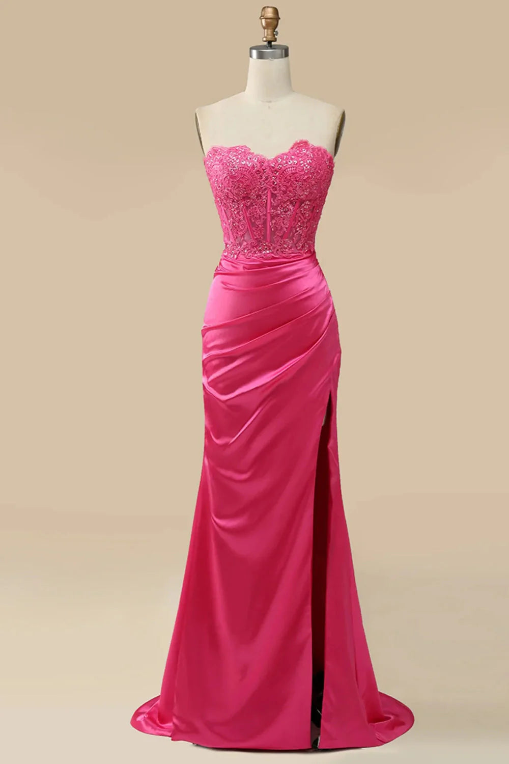 Woman wearing a sparkly long sheath prom dress with a high slit.