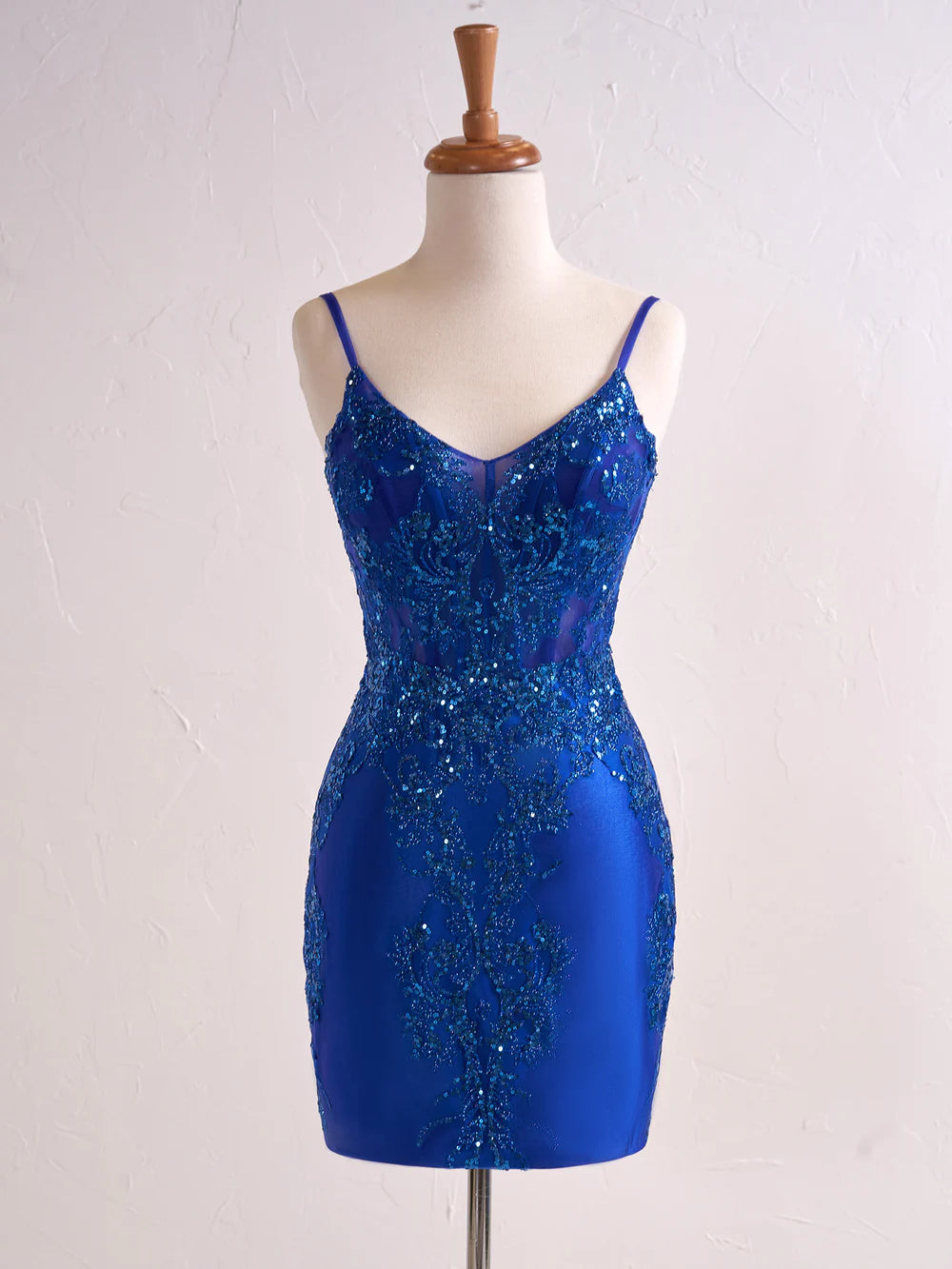 Back view of the short sequin prom dress with corset detailing.