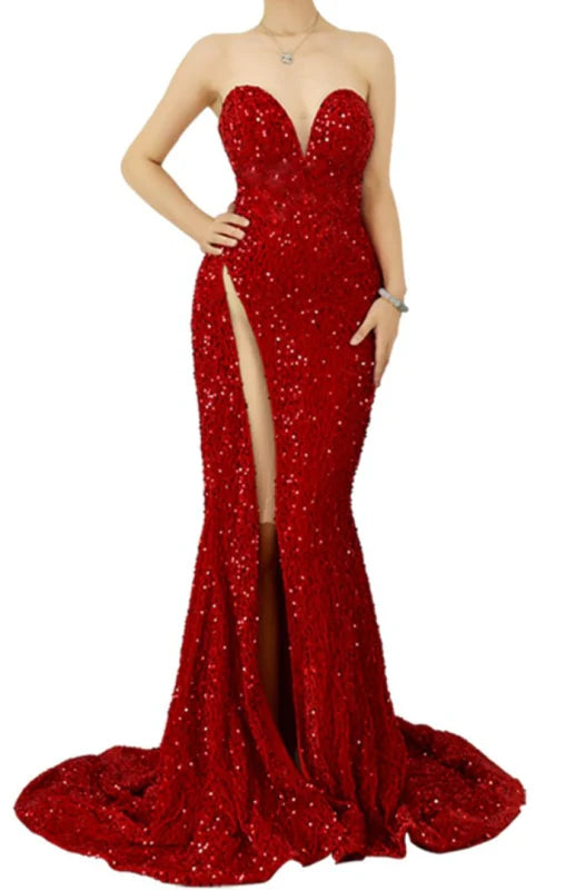 Model wearing a dazzling sweetheart sequin sleeveless prom gown with a high slit.
